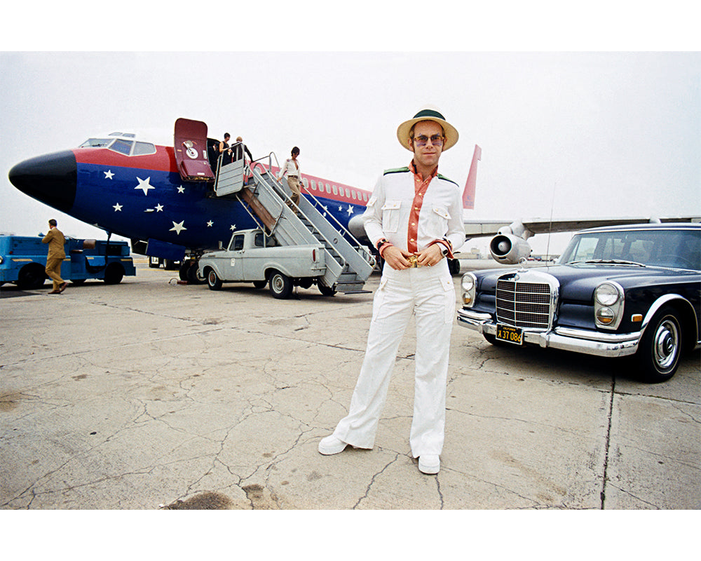 Elton John with his private plane, 1974