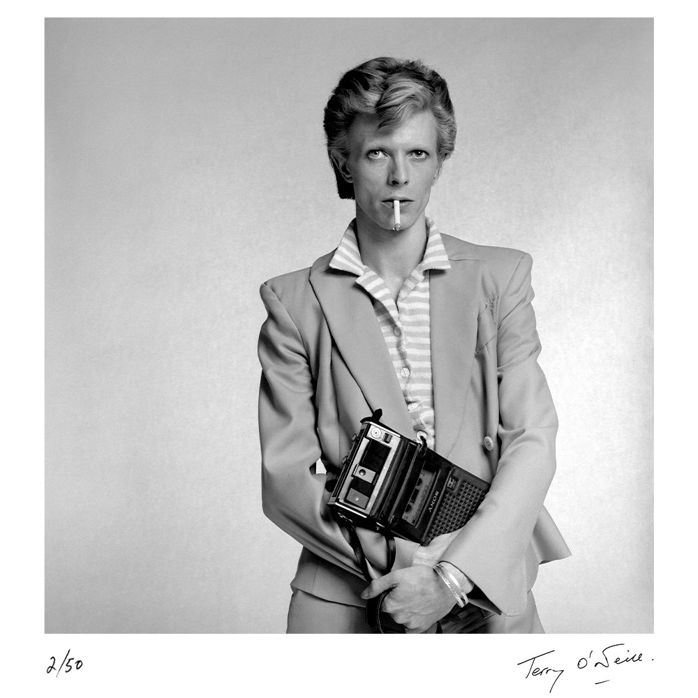 David Bowie holding a cassette player, 1974